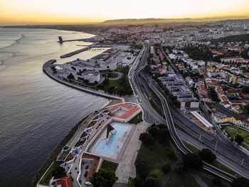 High angle view of road by buildings in city