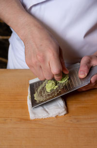 Chef grating fresh wasabi
