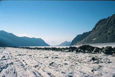 Scenic view of mountains against clear blue sky