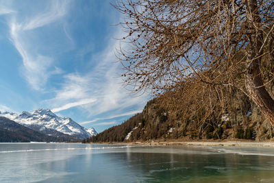 Silvaplana, switzerland, feb 21, 2023 panorama with the lake of silvaplana and the mount corvatsch 