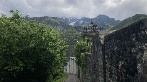 Scenic view of mountain against cloudy sky