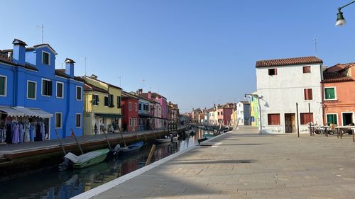 Canal amidst buildings in city