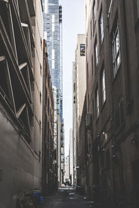 Narrow alley amidst buildings in city