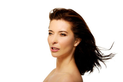 Portrait of woman against white background
