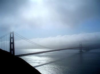 Golden gate bridge over san francisco bay against cloudy sky