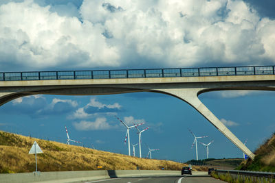 Bridge over road against sky