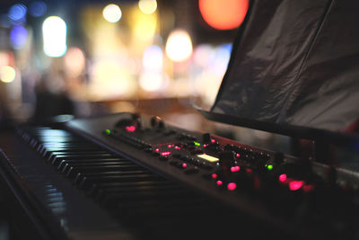 Close-up of illuminated lighting equipment at night