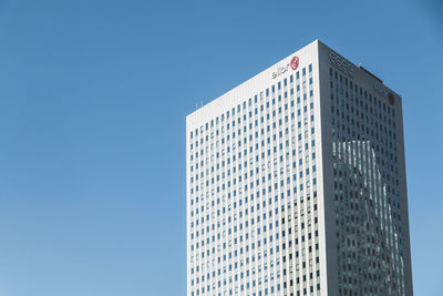 Low angle view of modern buildings against clear blue sky