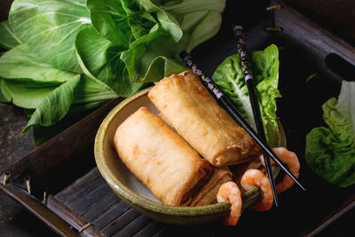 High angle view of spring rolls served in plate