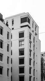 Low angle view of apartment building against sky