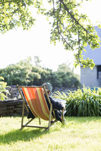 Man sitting on sun chair, oland, sweden