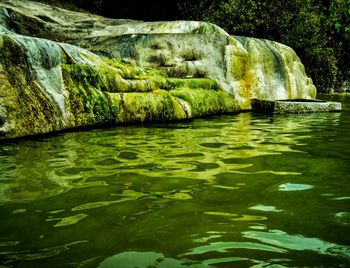 Scenic view of river flowing in cave