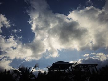 Low angle view of silhouette trees against sky