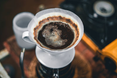 High angle view of coffee cup on table