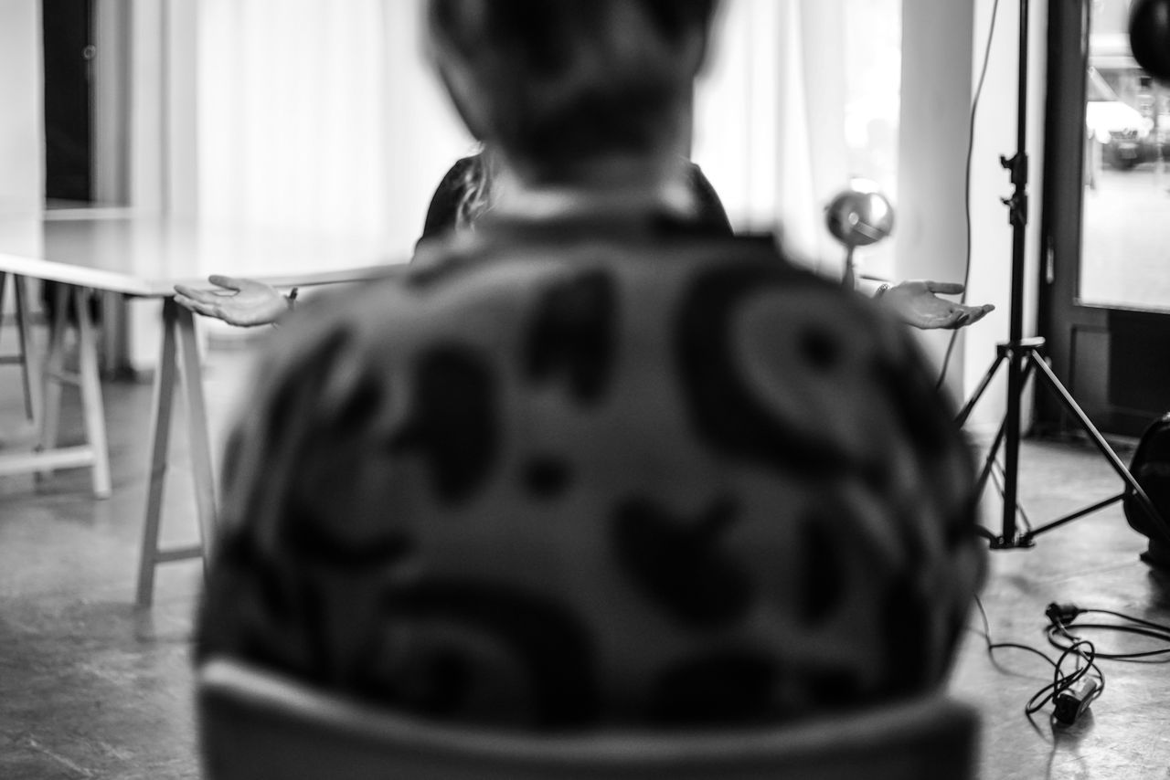 one person, rear view, indoors, real people, selective focus, home interior, lifestyles, table, day, close-up, window, women, childhood, architecture, child, headshot, seat, portrait, hairstyle