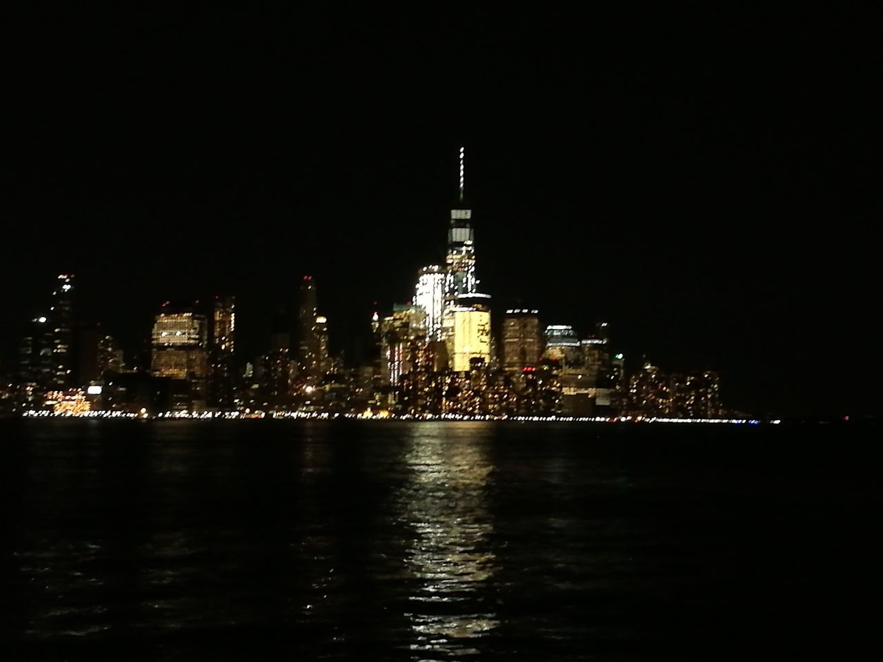 night, architecture, illuminated, building exterior, built structure, city, waterfront, travel destinations, no people, outdoors, water, skyscraper, modern, sky, cityscape