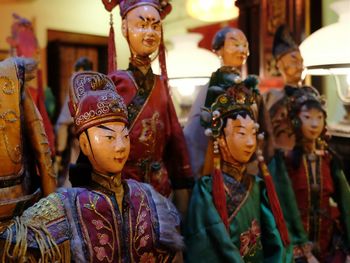 Traditional wooden puppets arranged in row