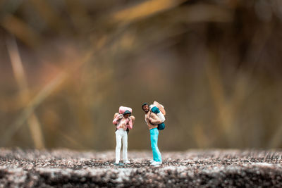 Figurines of hikers on walkway