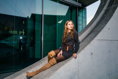 Portrait of woman sitting outdoors