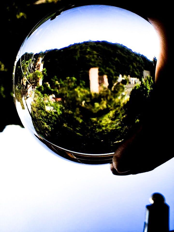 reflection, human hand, planet earth, human body part, one person, adults only, outdoors, nature, day, people, close-up, sky, adult