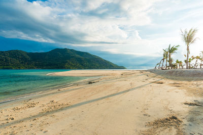 Scenic view of beach against sky