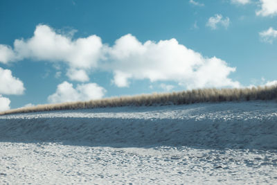 Scenic view of landscape against sky during winter