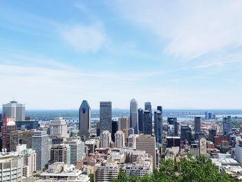 Modern buildings in city against sky