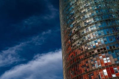 Low angle view of modern building against blue sky