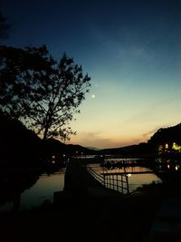 Scenic view of lake against sky at sunset