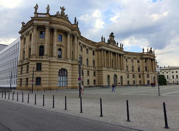 Low angle view of historic building against cloudy sky