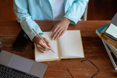 Midsection of man working in office