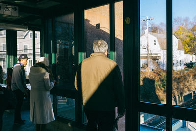 Woman standing in front of building