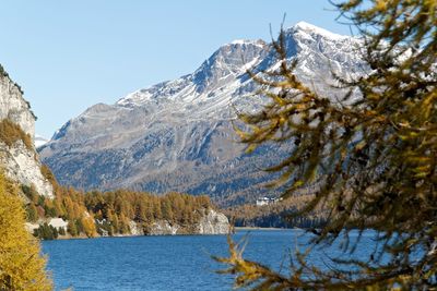 Scenic view of frozen mountains against sky