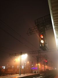 Illuminated street lights in city at night