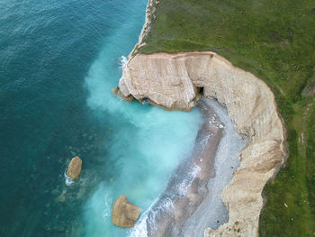 High angle view of rock on sea shore