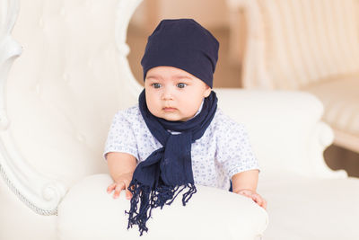 Portrait of cute baby girl at home