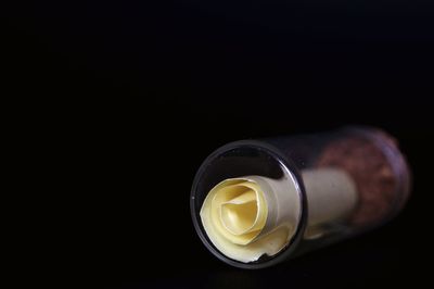 Close-up of bottle against black background