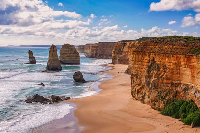 Rocks on beach against sky