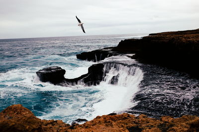 Waves splashing on rocks