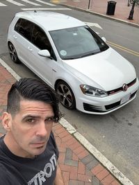 Portrait of man in car on street