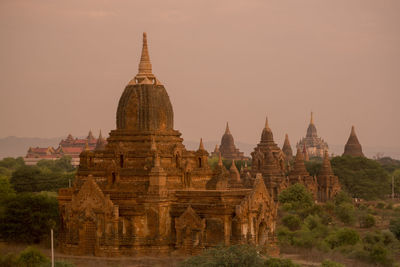 Historic temple against sky during sunset