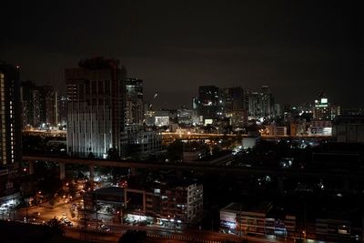 High angle view of illuminated buildings in city at night