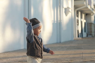 Full length of boy standing outdoors