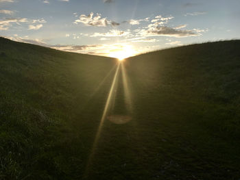 Scenic view of landscape against sky during sunset