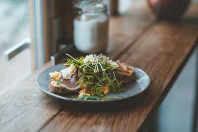 Sandwich served on plate at cafe