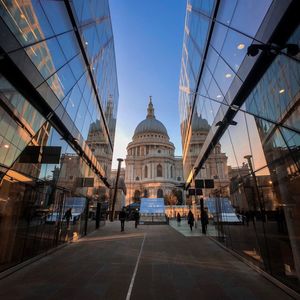 Low angle view of st paul cathedral in city against sky