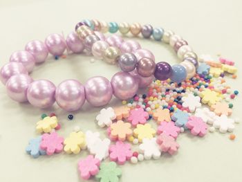 Close-up of colorful bracelets on white background