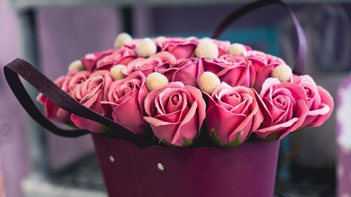 Close-up of pink roses on table