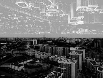 High angle view of buildings in city at night