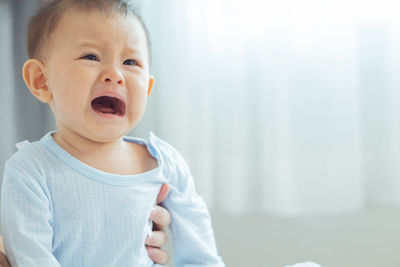 Portrait of cute baby girl at home